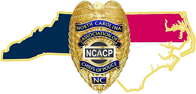 NC Association of Chiefs of Police Logo - NC police badge over red, white, and blue map of NC