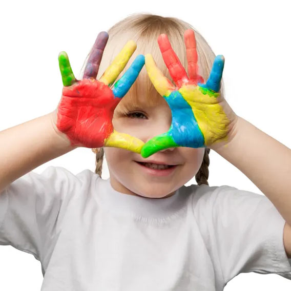 Photo of a little girl with colorful paint on her hands